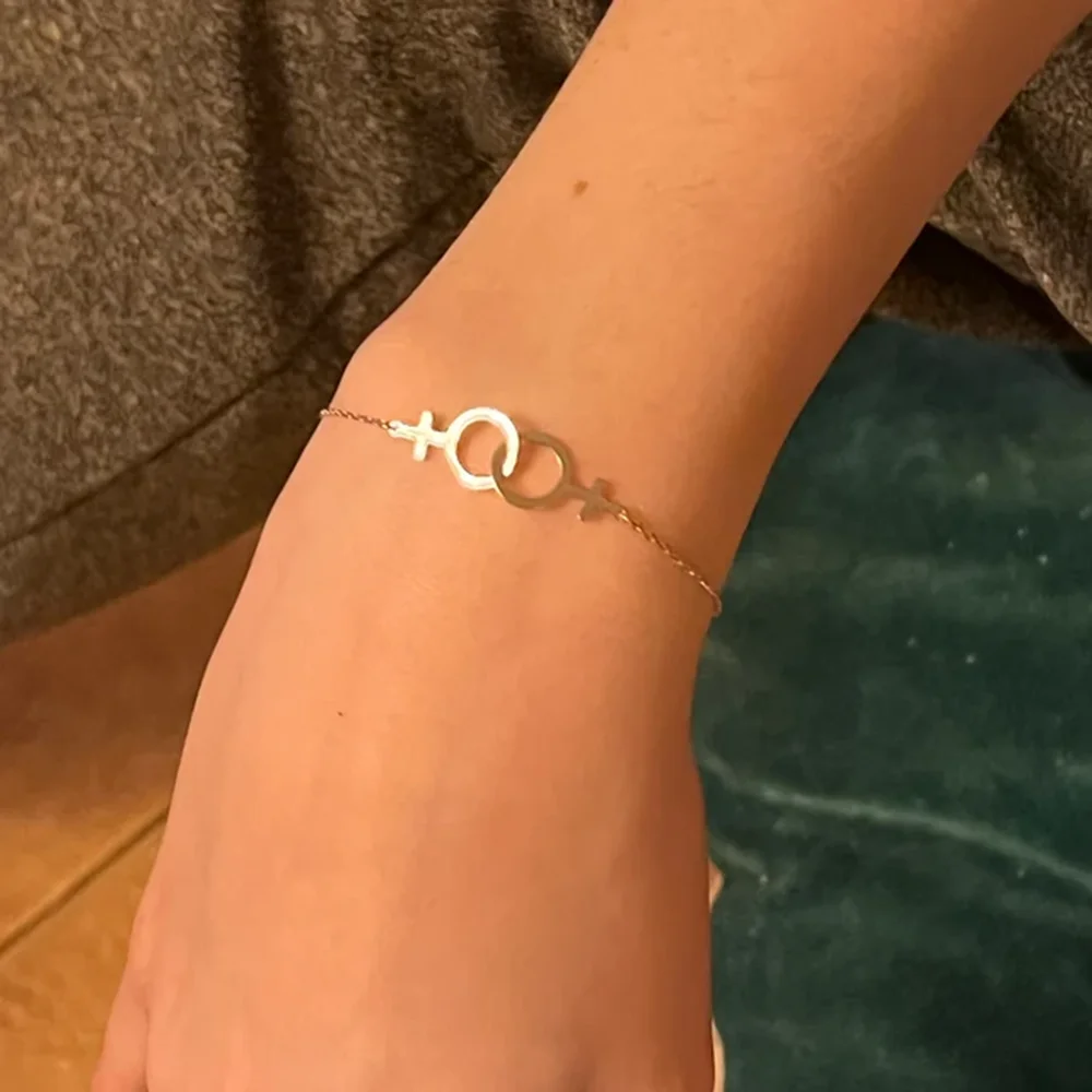 Женский браслет из нержавеющей стали с символом двойной венерины