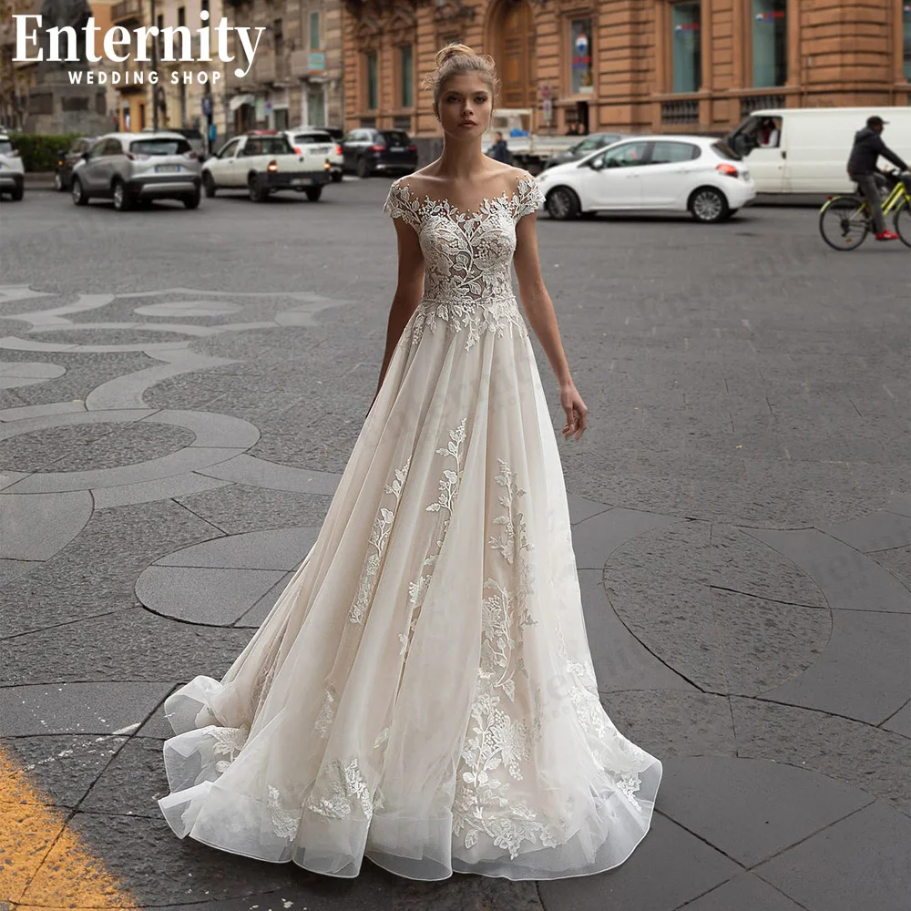 

Newfangled Sheer Scoop Neck Wedding Dresses A-Line Lace Appliques Backless With Cap Sleeves 2022 Bridal Gown Custom Made