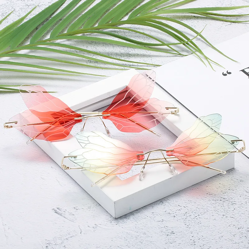 

Gradient dragonfly glasses ins Europe and the United States fashion frameless gradient ladies sunglasses Accessories