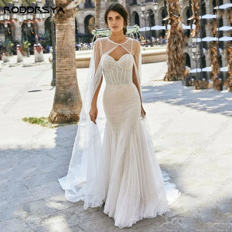 

RODDRSYA Pearl Beaded Wedding Dress Glitter Tulle Open Button Back Bridal Gowns Sexy Spaghetti Straps Bride Party With Cape