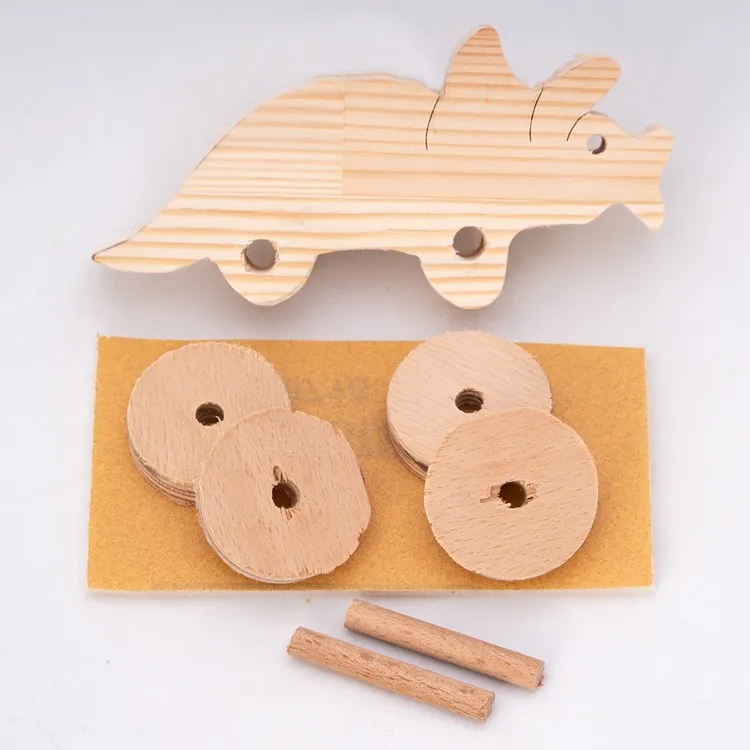 Wooden Toys Atelier Игрушка динозавра трицератопса с деревянными колесами