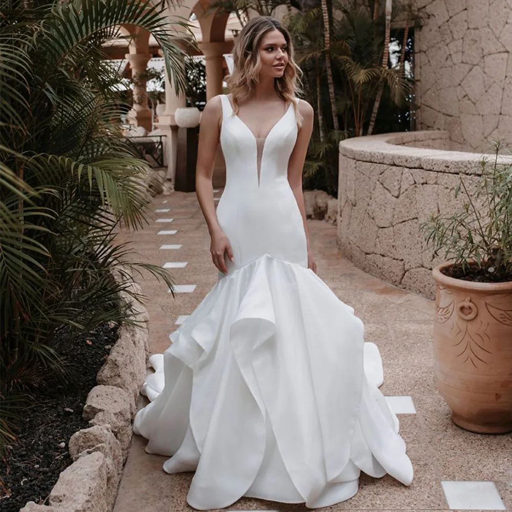

Chic Deep V-Neck Sleeveless Mermaid Wedding Dress Irregular Floor Length Bridal Satin Sexy Open Back with Buttons Bride Gowns