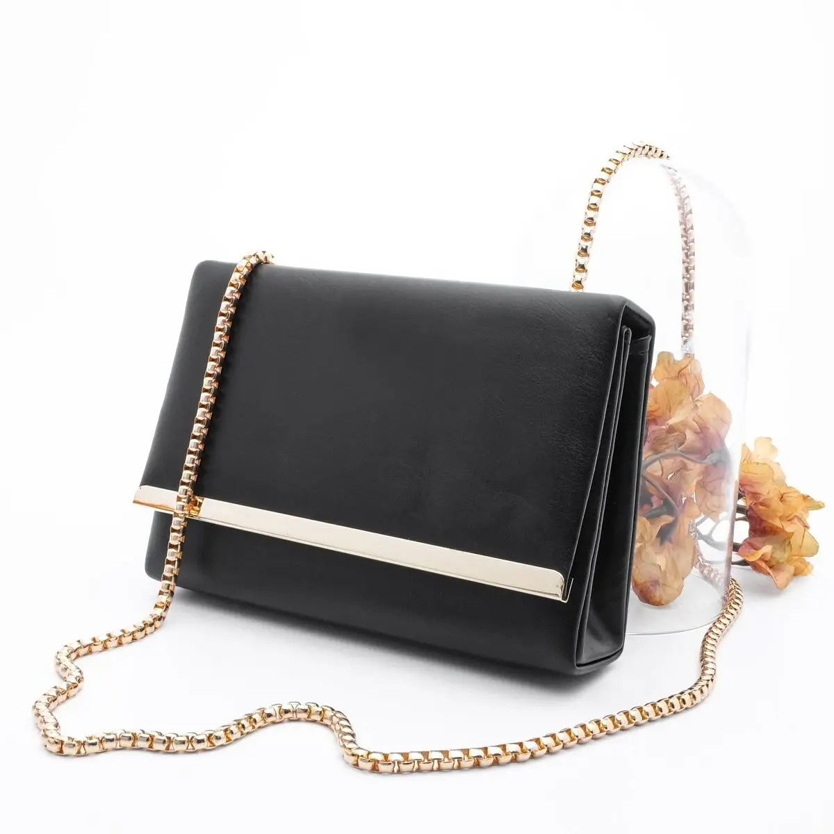

Yekva Gold Chain Strap Single Compartment Faux Leather Magnet Clamshell Women's Bag Black White Color Metal Striped Poshnmore