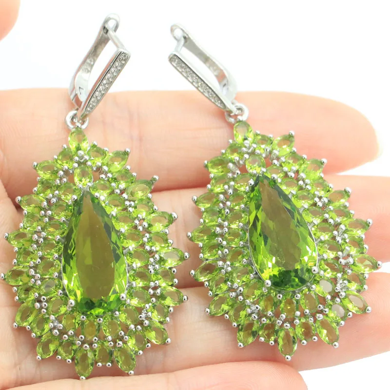 

Серьги женские длинные из серебра 14,4 пробы с зеленым Перидотом, 58 х31 мм