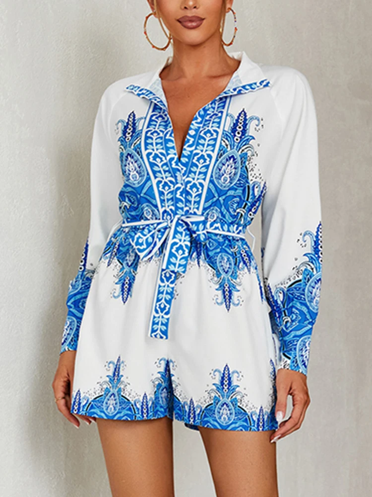 

Glamaker 2022 Autumn Blue Floral Print Romper Women Elegant Long Sleeve V-neck Belt Jumpsuit Wide-leg High Waist Pocket Playsuit