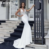 intriguing deep v neck mermaid wedding dress 2022 sleeveless appliques backless cheap bridal gowns for women sweep train