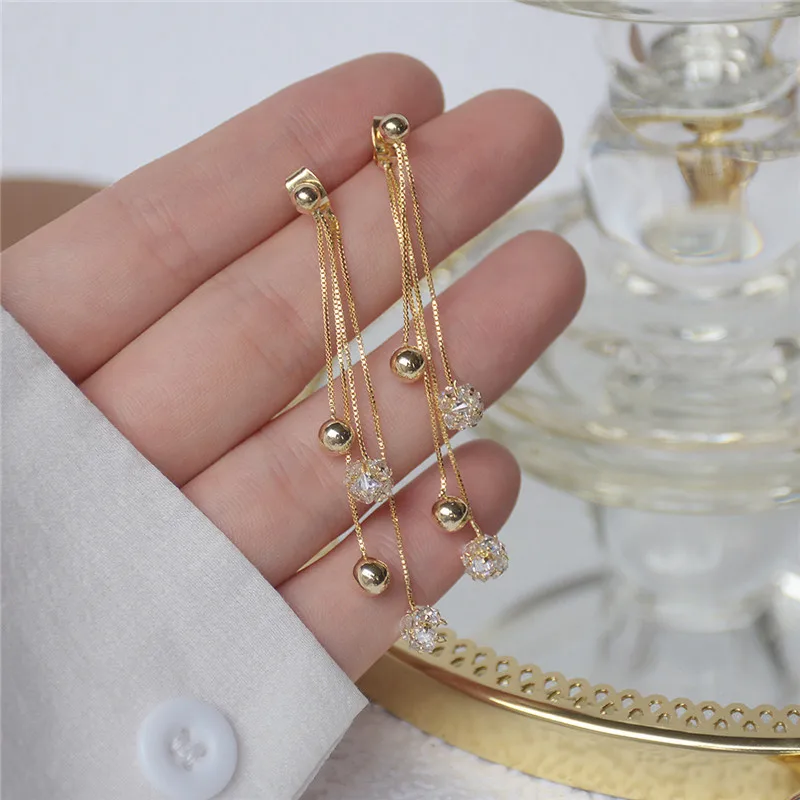 

Ins Hot Sale Luxury 14K Real Gold Tassel Diamond Ball Metal Beanie Long Stud Earrings for Women Cubic Zircon ZC Earrings