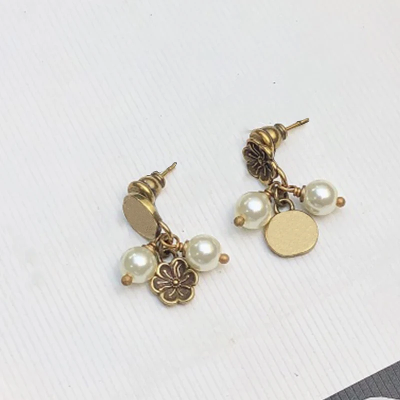 

2022 gujiaGG female new tide net simple cabinet temperament cold wind white bell stud earrings Pearl drop earrings,with box bag