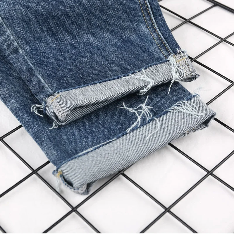 Женские штаны шаровары Джинсовые весенние рваные Отбеленные джинсовые брюки с