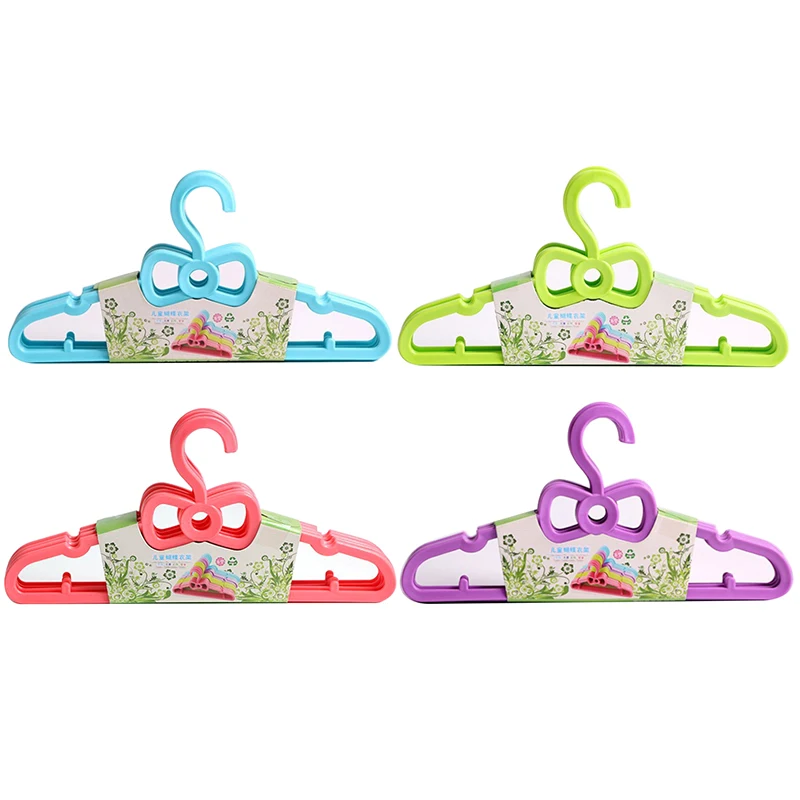 

5pcs Set Children's Bow Hanger Home Baby Clothes Hanger Plastic Portable Cute Clothes Hanger Household New Hot Sales In Stock