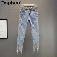 2021 autumn hot rhinestone fringed pencil pants stretch slim high waist light blue ripped jeans women denim pants female trouses