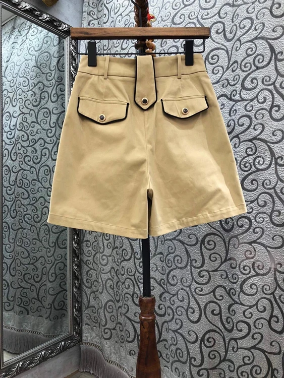 

2021 early spring new women's diagonal symmetrical pocket decoration solid color A-line casual shorts 101