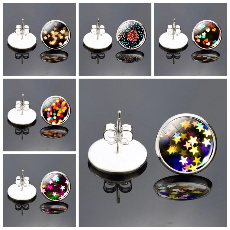 

Серьги-гвоздики серебряного цвета с изображением цветов и звезд