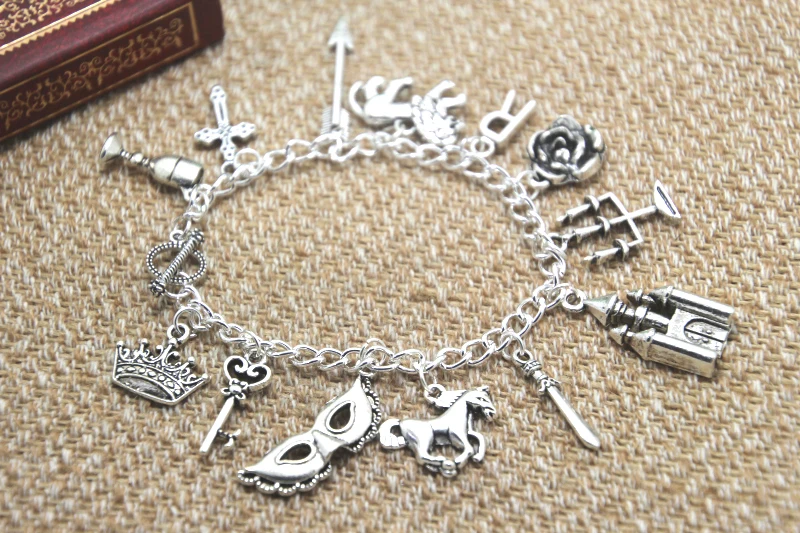 

12pcs Reign inspired bracelet Goblet Cross Lion Rose Candelabra charm bracelet