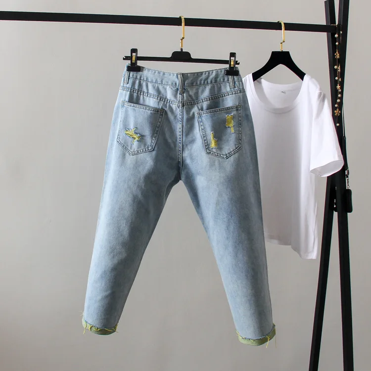 

FY001 Large size women's ripped jeans loose slim feet Harlan cropped trousers.