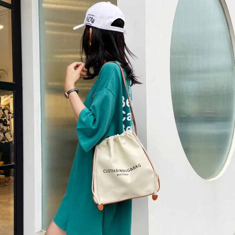 

Новинка, Женская Холщовая Сумка на плечо, хлопковые кожаные Лоскутные сумки-ведра с буквенным дизайном, сумка на шнурке, сумка-тоут, кошелек,...