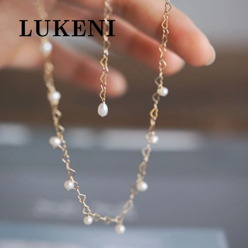 

Women Chokers Necklaces Hollow Simple Style Egg Shaped Pearl Jewelry Personality Female Gold Color Heart Chains Party Necklace