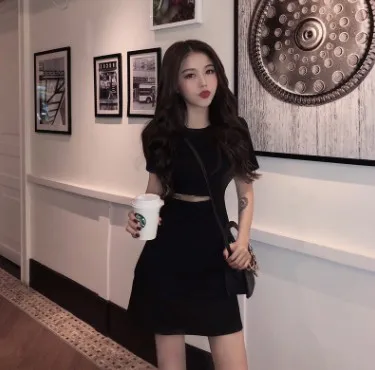 

2021 summer new Korean girl heart show slim black skirt high waist hollow out medium length dress