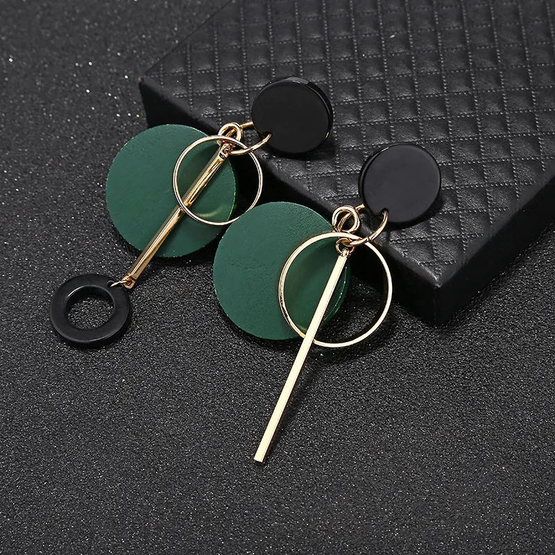 

Popular European and American fashion versatile round wood metal long tassel asymmetric exaggerated earrings earrings