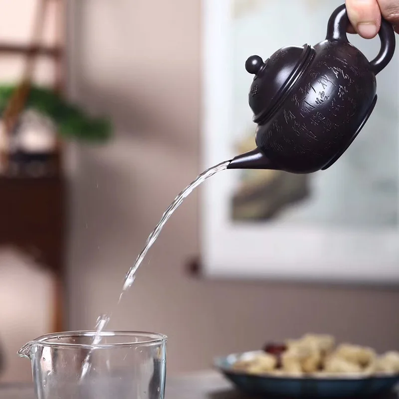 

Hule Mingxuan Yixing purple clay pot black gold clay lettering horizontal teapot small capacity Kung Fu teapot