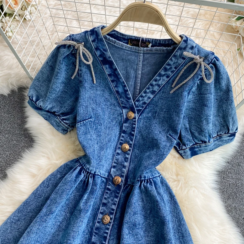 

Amolapha Women Sweet Style Single Breasted Short Sleeve V-Neck Bow High Waist Summer Denim A-Line Dress