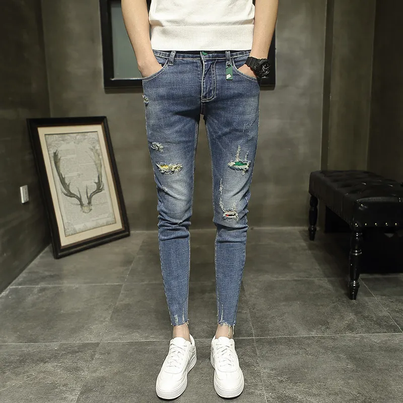 

Wholesale 2021 teenagers casual street spirit guy new student jeans ripped feet pants pencil pants Korean slim thin male pants