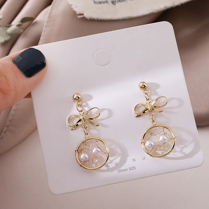 

Korean metallic pearl earrings with geometric bow studs earrings