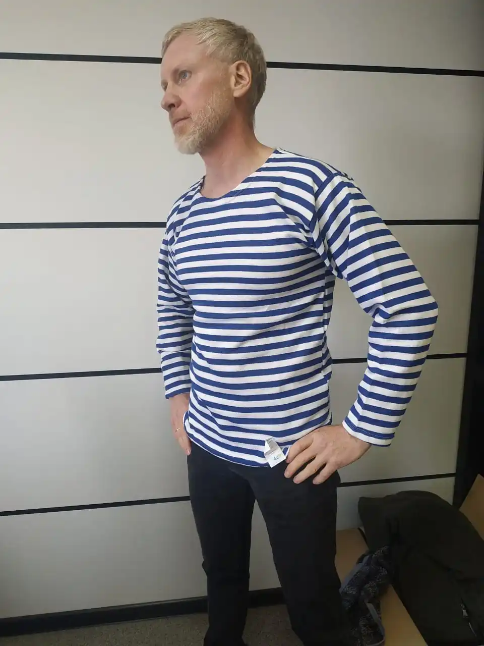 A vest with a fleece on bike cotton blue and black strip. |