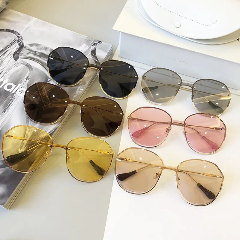 

Round Rimless Clear Sunglasses Women Vintage One Piece Oversized Sun Glasses For Female Fashion Party Hollow Metal Shades UV400