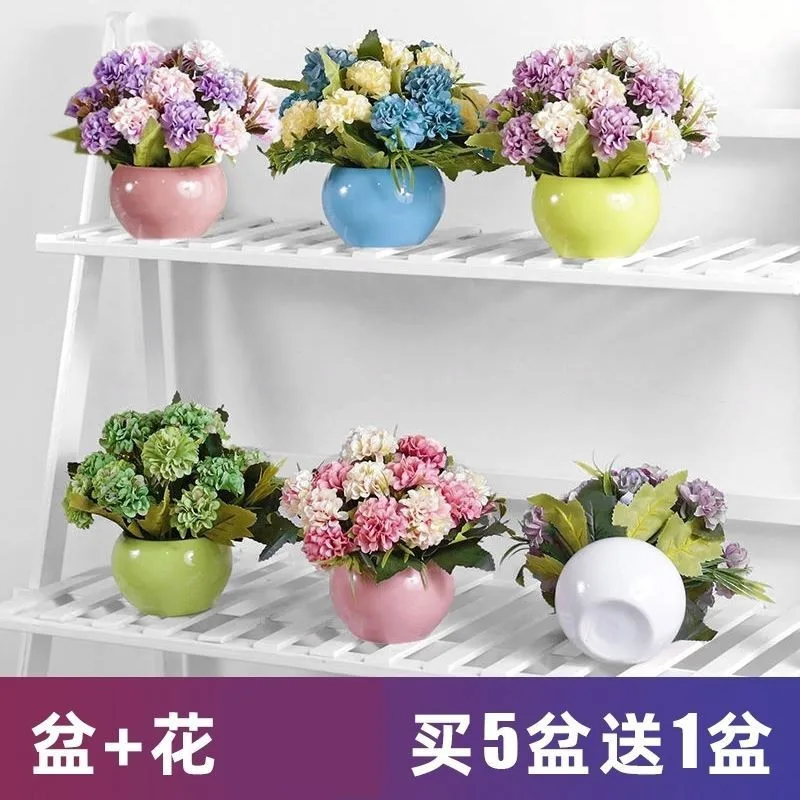 

The decoration next to the TV, the flower room, the living room, the tea table, the simulation flower plant, the small potted