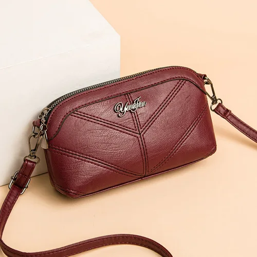 

One shoulder female bag middle-aged woman hand in hand to take change storage postman bag
