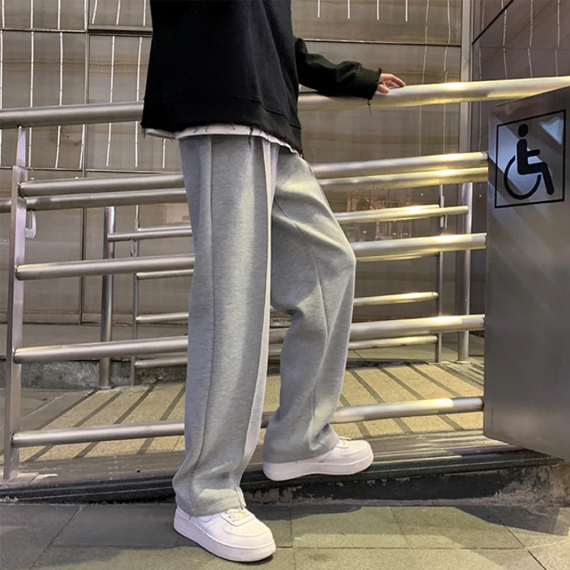 Pantaloni della tuta uomo pantaloni dritti Harem uomo coreano uomo pantaloni Casual allentati