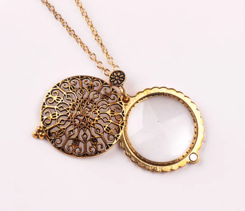 

New jewelry fashion personality hollow-out retro magnifying glass pendant can be opened lovers pendant retail wholesale