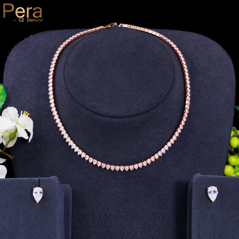 Серьги-гвоздики в виде капли воды из белого и золотого фианита | Украшения