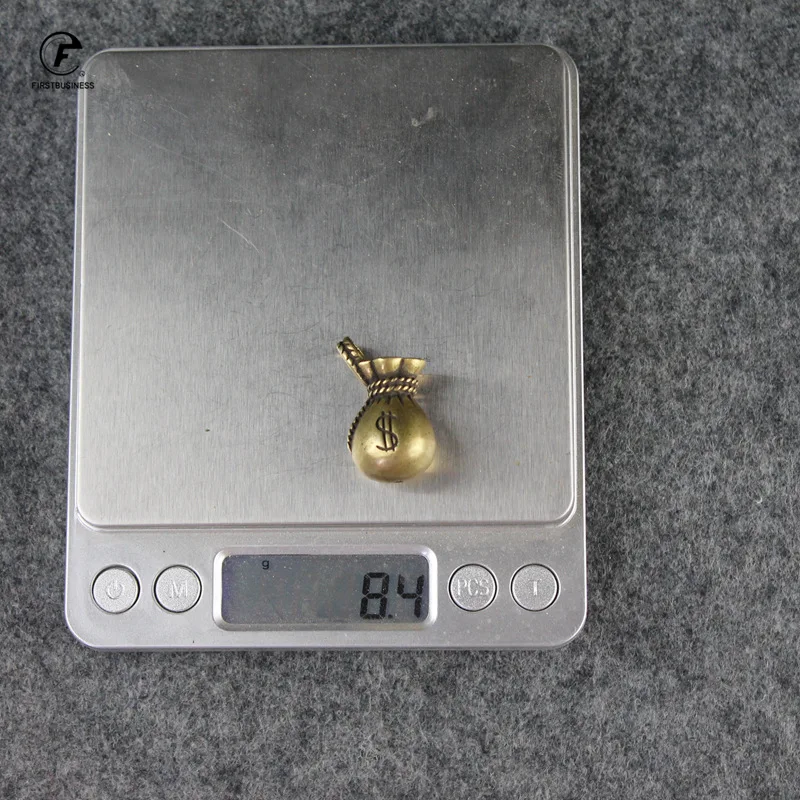 

Медный брелок в форме доллара