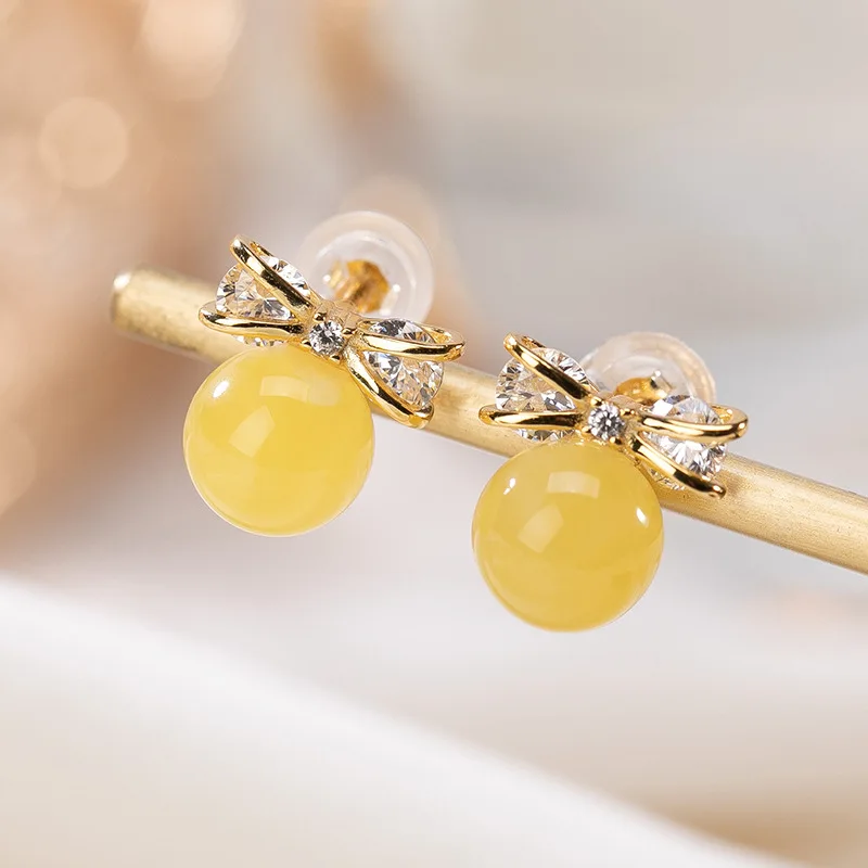 

Natural 925 sterling silver gilt bow-knot round beads amber retro temperament amber women earrings 925 earrings