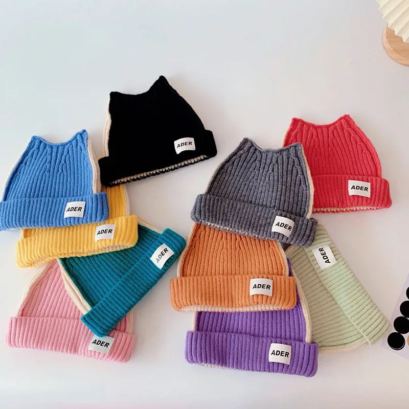 

2021 Hot Sale Korean Children Knitted hat Autumn/Winter Contrasting color cat-shaped ears cloth label cap boy girls cap
