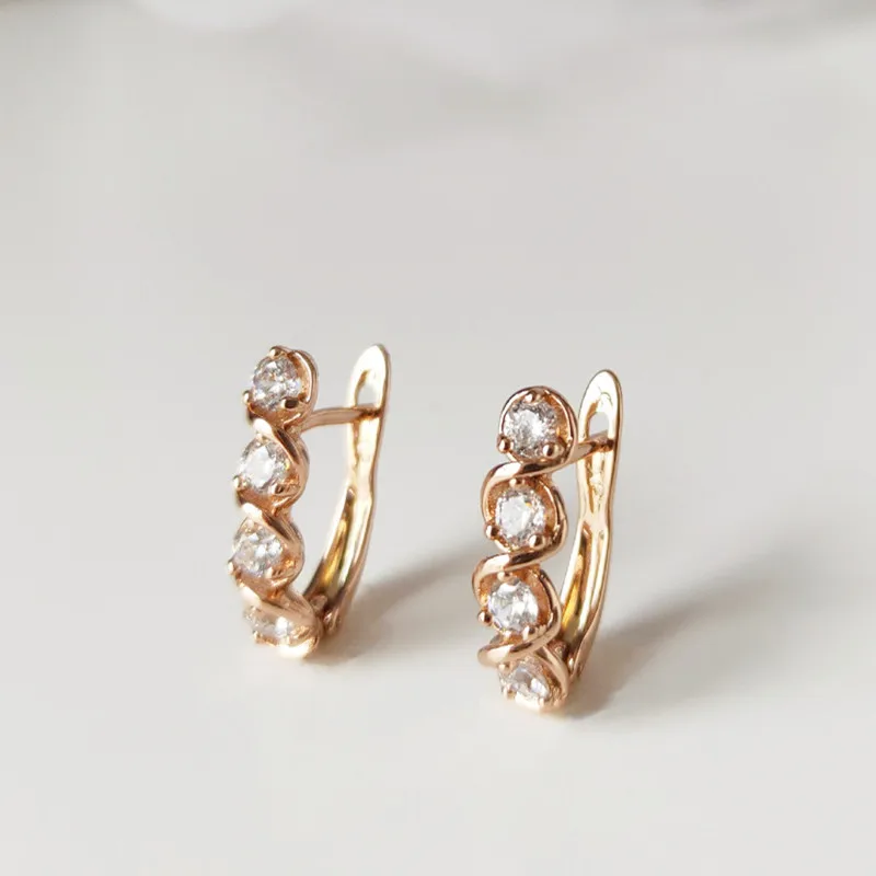 Серьги-гвоздики из розового золота 585 пробы с инкрустацией циркона праздничный