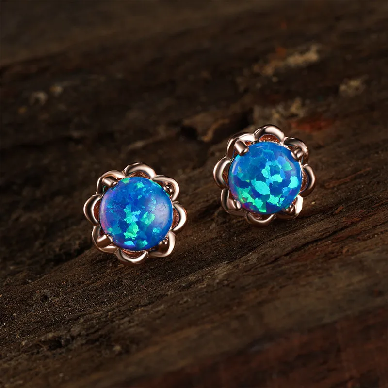 Серьги-гвоздики женские из розового золота и серебра с белым синим огненным