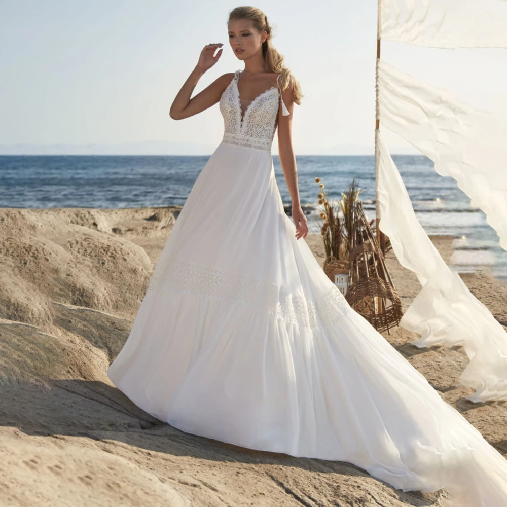 

UETEEY Spaghetti Straps Wedding Dress Bohemian Sexy Deep V-Neck Sweep Train A-Line Sleeveless Backless Bride Gowns 2021