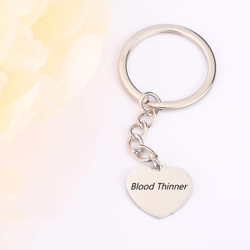 Двусторонний брелок с одной гравировкой другой стороны выгравированным