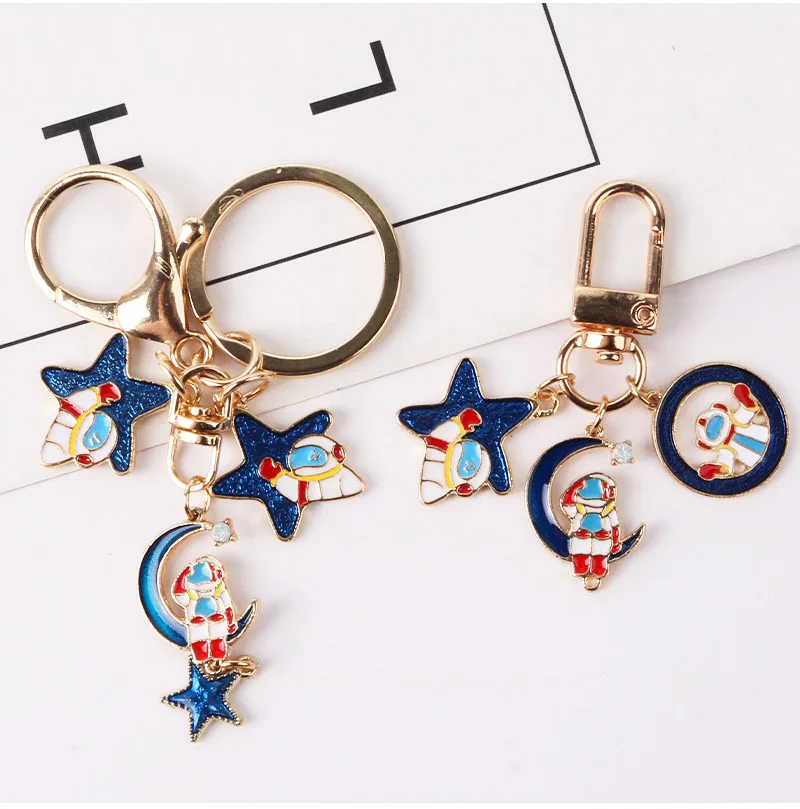 

Escape from the earth UFO Space Craft Astronaut Rocket Planet Spaceman Universe Stars Enamel Key Ring KeyChain For astrophile