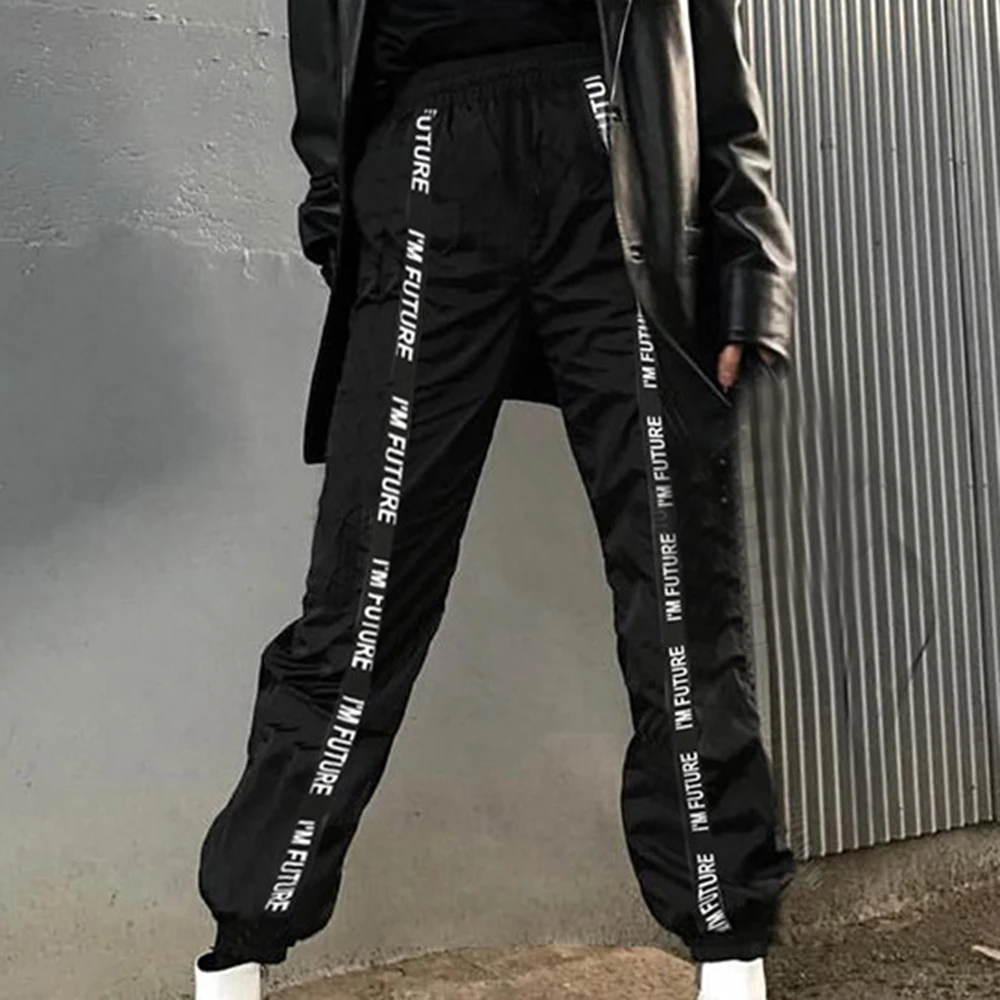 Яркие блестящие штаны для бега с лентами женские спортивные на осень 2019