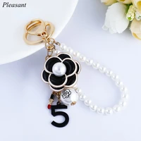 2021 creative new dripping camellia pearl keychain pendant bag keychain pendant small jewelry gift accessories wholesale