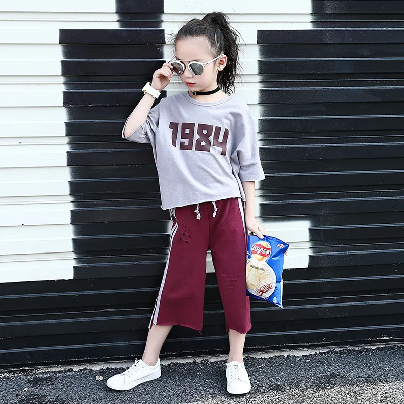 

2021 new summer girls tide fei children's short sleeve T-shirt coat cuhk han edition 7 minutes of pants two dresses wholesale