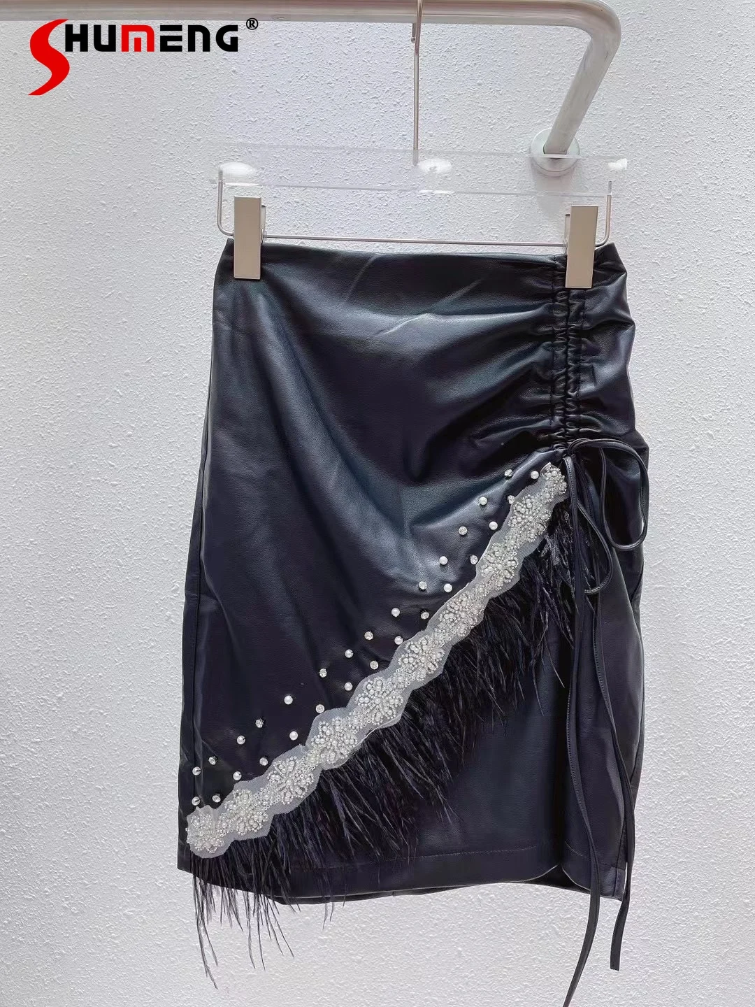 

Female New Fashion Black Beaded Leather Mini Skirt Women's 2021 Autumn Solid Streetwear Irregular Drawstring Feather Hip Skirt