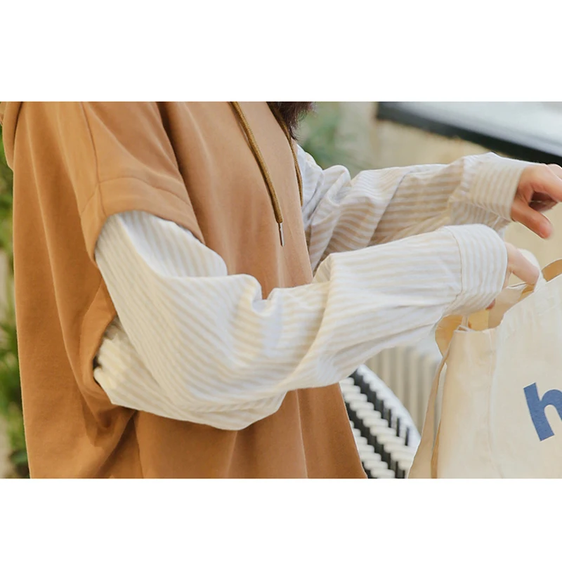 

2019 autumn and winter new fake two-piece striped stitching hooded Sweatshirt female loose head long-sleeved shirt