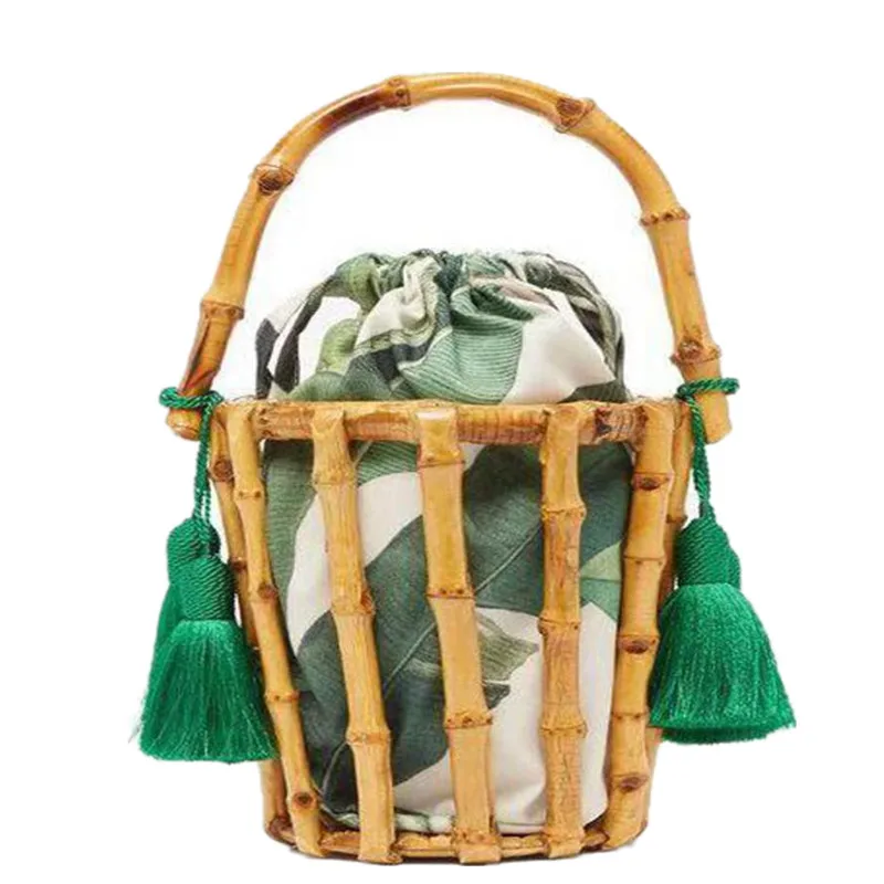 

New product launch in 2021 Handmade Women's Handbags tassel bamboo bag sewing bag hollow bucket bag beach bag for holiday