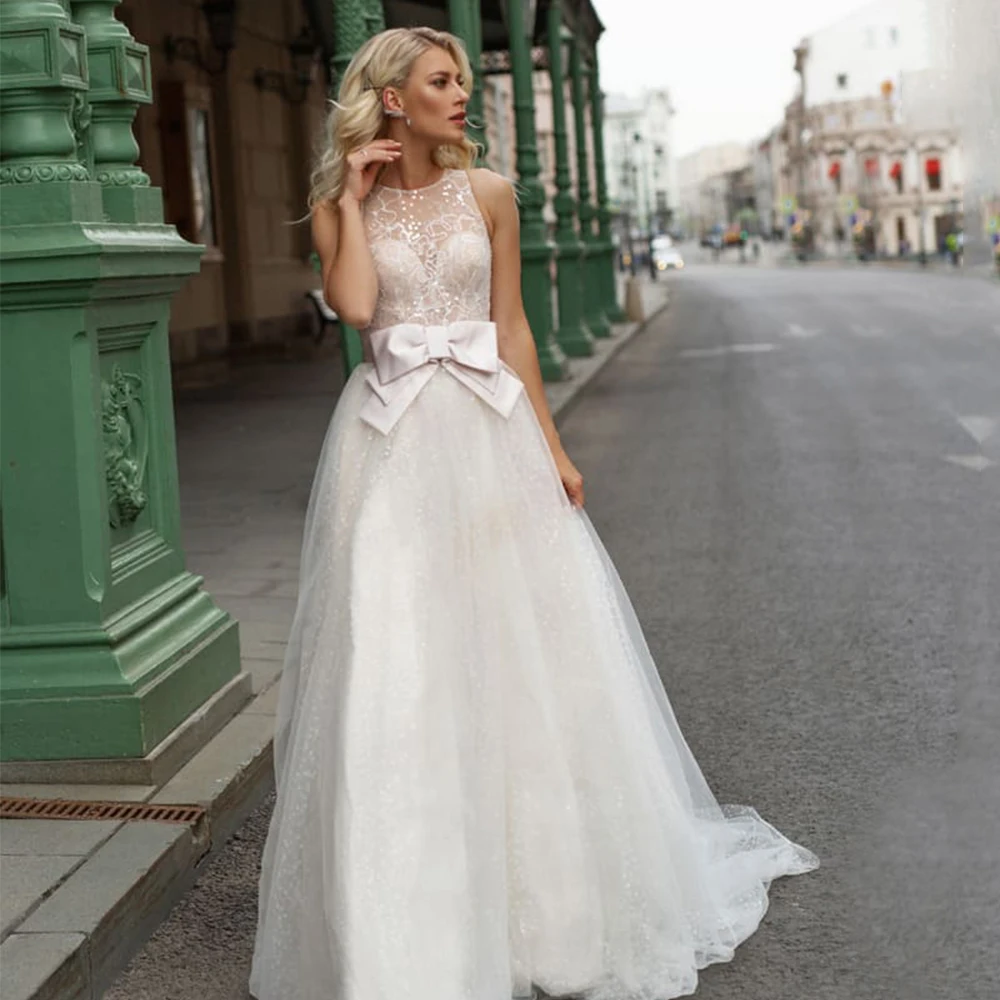 

Shining A-Line Wedding Dress Custom Made Boat Neck Sleeveless Big Bow Applique Paillette Button Sweep Train 2021 Bridal Gowns