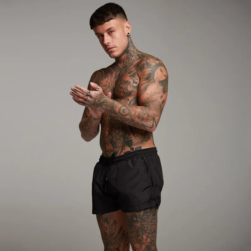 

Muscle fitness brothers summer new sweat-absorbent quick-drying sports pants fitness running slim elastic breathable men's short